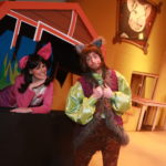 Dan Chevalier as Alexander T. Wolf & Ashley Laverty as Magill in THE TRUE STORY OF THE THREE LITTLE PIGS