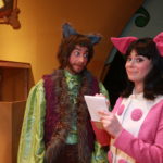 Dan Chevalier as Alexander T. Wolf & Ashley Laverty as Magill in THE TRUE STORY OF THE THREE LITTLE PIGS