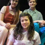 Belle Rangel as Margot Frank, Otto Fox as Peter van Daan and Sophie Williams as Anne Frank in THE DIARY OF ANNE FRANK at The Rose Theater