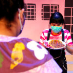 Mireya Luna as Carmela and Tatiana Sandoval as Mami in The Rose Theater's production of CARMELA FULL OF WISHES, making its world premiere Jan 28 - Feb 13, 2022.