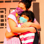 Tatiana Sandoval as Mami and Mireya Luna as Carmela in The Rose Theater's production of CARMELA FULL OF WISHES, making its world premiere Jan 28 - Feb 13, 2022.