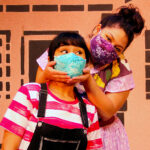 Mireya Luna as Carmela and Tatiana Sandoval as Mami in The Rose Theater's production of CARMELA FULL OF WISHES, making its world premiere Jan 28 - Feb 13, 2022.