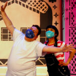 Isaiah Ruiz as Big Brother shows Mireya Luna as Carmela the power of wishes in The Rose Theater's production of CARMELA FULL OF WISHES, making its world premiere Jan 28 - Feb 13, 2022.