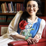Biannah Peji-Palm as Belle in The Rose Theater's production of BEAUTY AND THE BEAST, playing June 2 - 25, 2023.