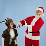 Martin Prieto and Patrick Wolfe as Santa Claus in The Rose Theater's production of RUDOLPH THE RED-NOSED REINDEER, playing December 1 - 23, 2023.