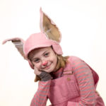 Scarlett Simpson as Wilbur in The Rose Theater's production of CHARLOTTE'S WEB, playing April 19 - May 5, 2024.-01